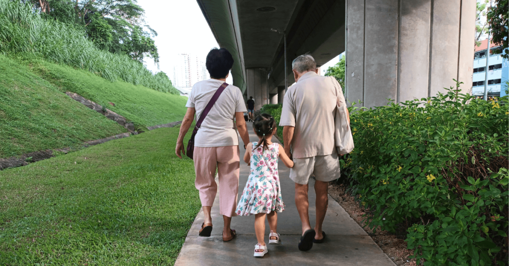 Grandparent helping to walk H